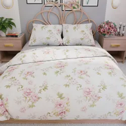 Elegancka pościel w pastelowych odcieniach różu i zieleni.